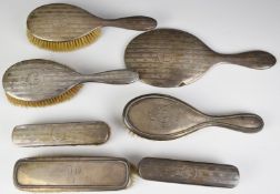 Hallmarked silver five piece dressing table set comprising hand mirror and four brushes, together