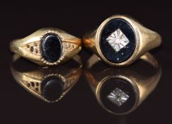 A 9ct gold ring set with onyx and a diamond and another 9ct gold ring set with onyx, 5.9g, size