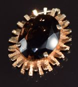 A 9ct gold pendant set with an oval cut smoky quartz, 6.6g, 3 x2cm