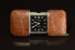 Movado purse watch with white arrow hands and hour markers, black dial, crocodile leather case and