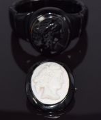 Whitby jet bracelet, the central piece a cameo depicting a young woman and a brooch set with a coral