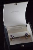 A pair of 18k white gold Movado earrings set with diamonds and glass, in original box, 16.5g