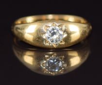 A c1900 18ct gold ring set with a diamond of approximately 0.25ct in a star setting, 3.7g, size K