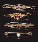 Three Edwardian 9ct gold brooches, one set with an amethyst and seed pearl, one paste and seed