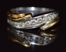 An 18k bi-coloured gold ring set with graduated diamonds, the total diamond weight approximately 0.