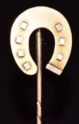 A 9ct rose gold stick pin in the form of a horseshoe, Birmingham 1896, 0.9g