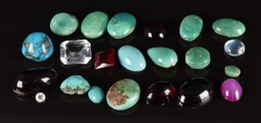 A group of cabochons comprising eleven turquoise, synthetic star ruby, four garnet, synthetic ruby