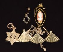 A 9ct gold pendant set with a cameo (2.1g), a 15ct gold Masonic pendant (4g), a 9ct gold pendant and
