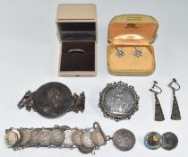 A collection of silver jewellery including Victorian bracelet set with a silver coin, Mexican coin