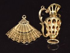 A 9ct gold charm in the form of a jug and a 9ct gold charm in the form of a fan, 8g