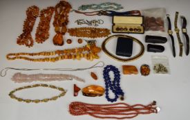 A collection of jewellery including coral, Boucher, five amber and a rose quartz necklace, silver