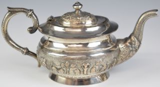 Indian or similar silver plated teapot with embossed decoration of figures and animals in
