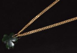 A 9ct gold necklace / chain (9.3g, 60cm) with nephrite jade pendant in the form of a shamrock (1.