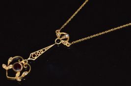 Edwardian necklace set with a garnet and seed pearls, 3.6g (chain broken)