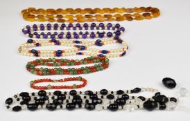 Five beaded necklaces including amethyst and pearls, amethyst, coral and lapis lazuli, quartz and