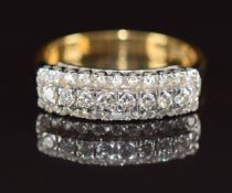 An 18ct gold ring set with three rows of diamonds, 5.9g, size P