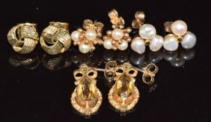 A pair of 9ct gold earrings set with citrine (2.7g), two pairs of 9ct gold earrings set with