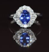 An 18ct white gold ring set with an oval cut tanzanite of approximately 1.19ct surrounded by round