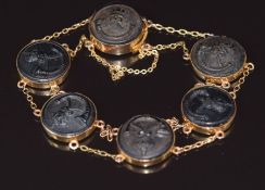 A 9ct gold bracelet set with six Royal King's Rifle Corps buttons, c1910, 16.7g 19cm