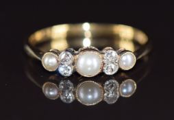A c1910 18ct gold ring set with split pearls and old cut diamonds, 1.8g, size N