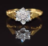An 18ct gold ring set with diamonds in a cluster, 2.5g, size J