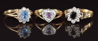 Three 9ct gold rings, one set with amethyst, one sapphire and paste and the other paste, 5.2g,