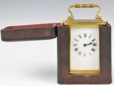 Brass cased carriage clock with white enamel dial and Roman numerals, marked to movement France,