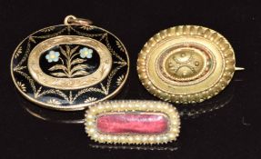 Victorian mourning locket set with black enamel in a floral design, verso a glass locket (7.8g),