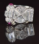 Art Deco platinum ring set with baguette, round and trillion cut diamonds with two ruby cabochons to