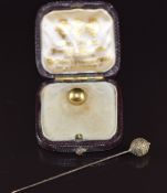 Victorian Etruscan Revival yellow metal stick pin (1.6g) in antique box and an 18ct gold stud (1.2g)