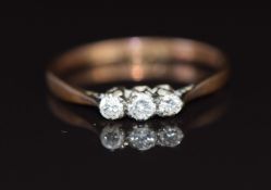 An 18ct gold ring set with three diamonds, 1.5g, size K