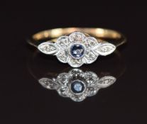 A 9ct gold ring set with a sapphire and diamonds in a platinum setting, 1.5g, size L