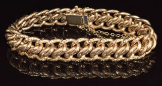 A 9ct gold bracelet with embossed decoration to the edges, 19.8g, 19cm