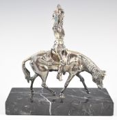 White metal model of Don Quixote on horseback, on marble base, height 14cm