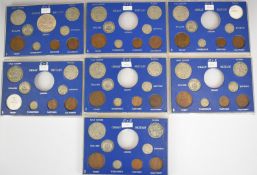 George V Great Britain year type coin sets in perspex cases, comprising incomplete sets from 1930-