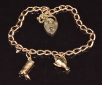 A 9ct gold charm bracelet with two 9ct gold charms, 12.4g, 18cm