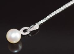 A 9ct white gold pendant set with a pearl and diamonds totalling approximately 0.09ct, on 9ct