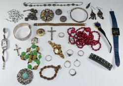 A collection of costume jewellery including Sphinx brooch, two silver bangles, three silver rings,