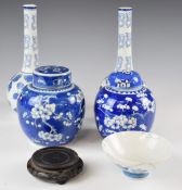 Two Chinese ginger jars with blue and white prunus decorations, Japanese blue and white bowl and a