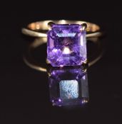 A 14k gold ring set with an emerald cut amethyst of approximately 6.1ct, 4.6g, size N