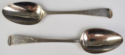 Two Georgian hallmarked silver table spoons with bright cut decoration, one London 1802 maker Peter,