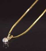 A 9ct gold pendant set with a diamond of approximately 0.15ct, on 9ct gold chain, 2.4g, 38cm