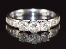 An 18k white gold ring set with three diamonds of approximately 0.28ct, 0.2ct & 0.2ct, 3.3g, size L