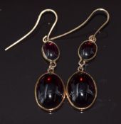 A pair of c1900 9ct gold earrings each set with two garnet cabochons, 4g, 2.7cm