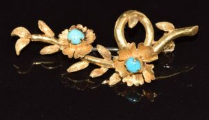 An 18ct gold brooch set with turquoise cabochons in a floral design, 6.6g, 4.5cm