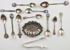 Hallmarked silver and continental silver collector's spoons and a pair of sugar tongs, some with