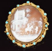 Victorian yellow metal brooch (tests as 18k) set with a cameo depicting a village scene within a