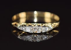A c1900 18ct gold ring set with five diamonds 1.7g, size M