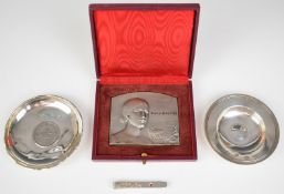Two silver pin dishes, one with inset 1973 Hong Kong dollar, the other feature hallmarked for London