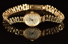 Le Cheminant 9ct gold ladies wristwatch with gold hands and hour markers, silver dial and quartz